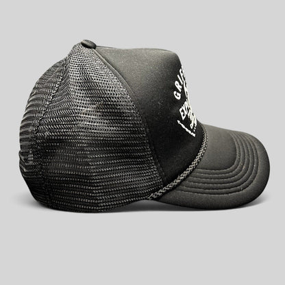 Raree Finds vintage black foam trucker hat with white Griffith Exploration mining graphic and braided brim detail.