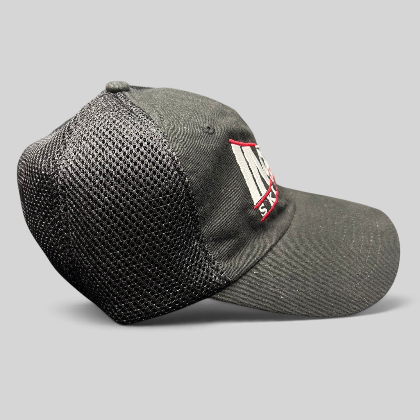 Raree Finds vintage black trucker hat with mesh back and embroidered Incline Ski Shop logo on the side profile