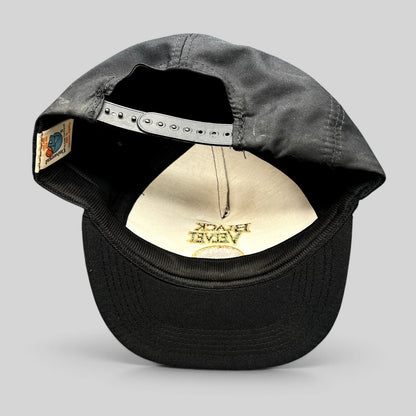 Raree Finds vintage Black Velvet Whisky snapback hat showing the interior label and adjustable plastic strap
