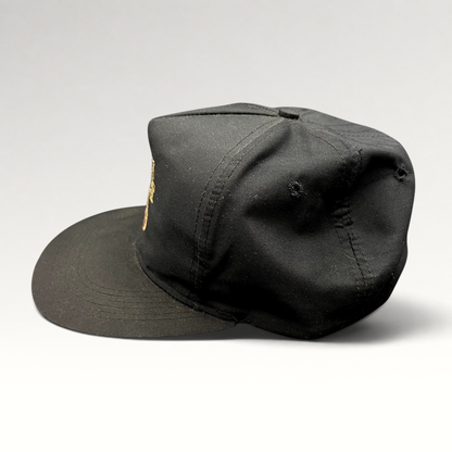 Raree Finds vintage black snapback hat with embroidered Black Velvet whisky logo and high-crown structured design.