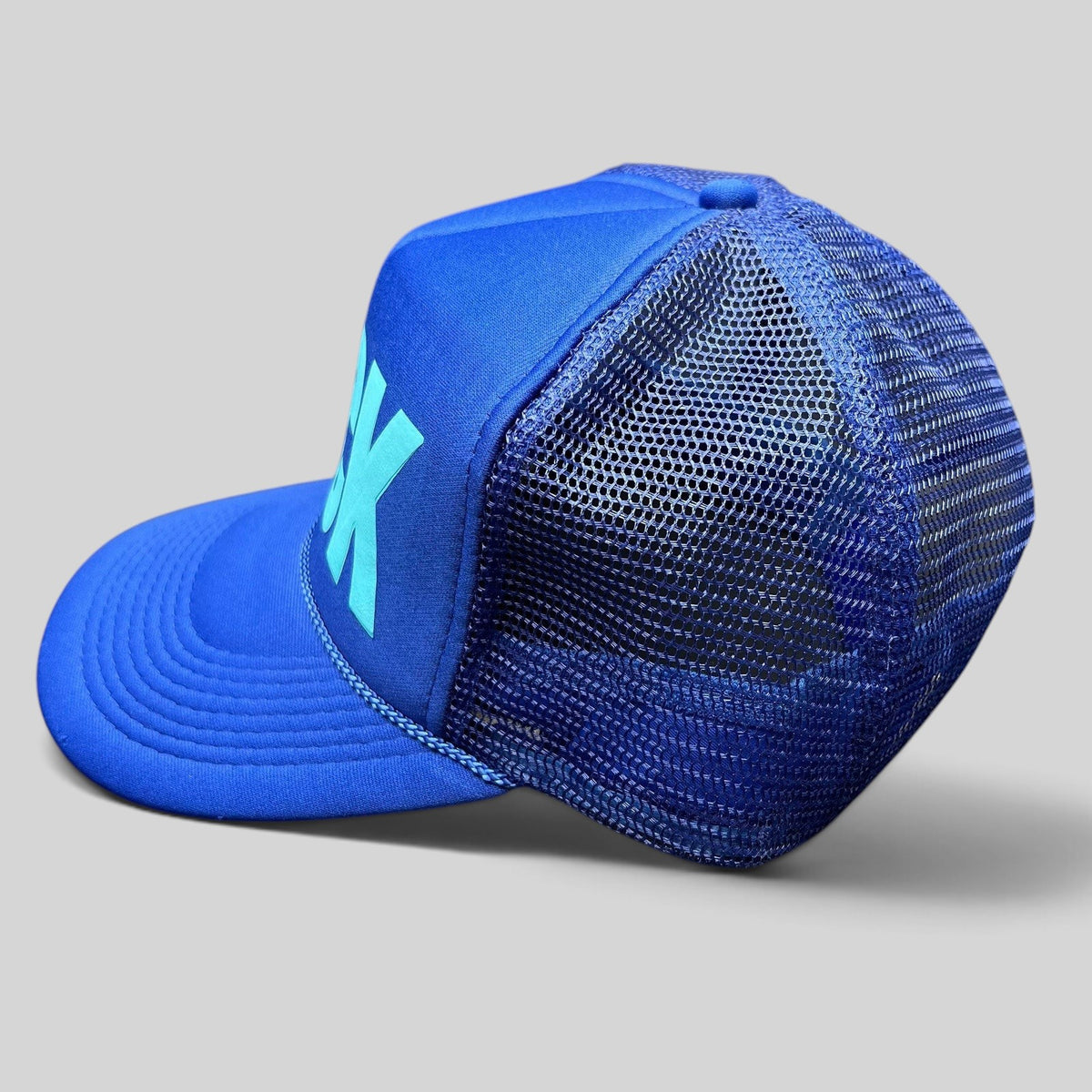 Raree Finds vintage royal blue Otto Collection trucker hat with teal BECK graphic, foam front, and mesh back.