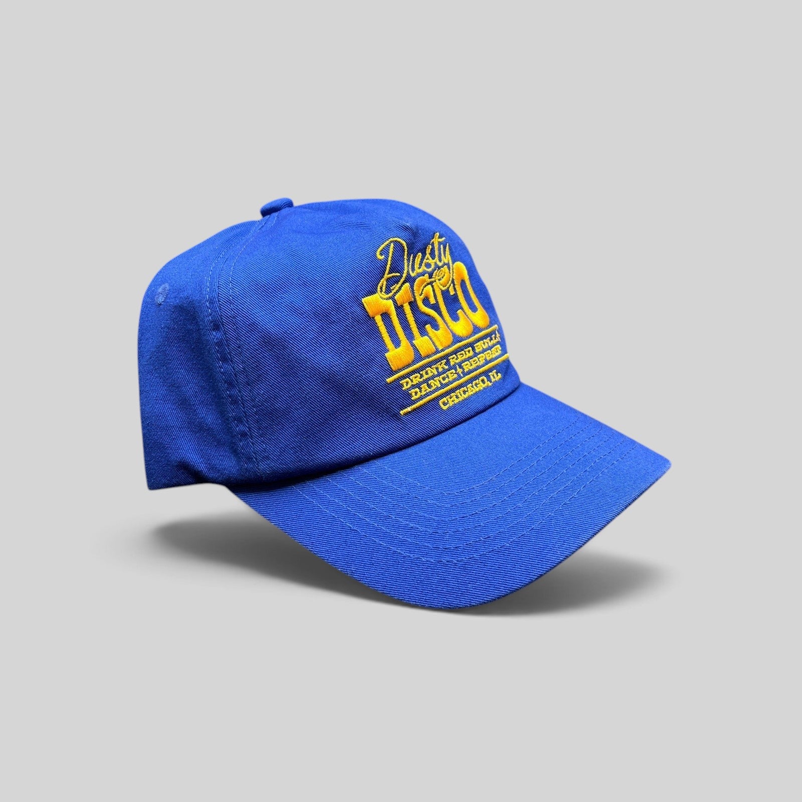 Raree Finds vintage royal blue snapback hat with yellow Dusty Disco Chicago embroidery and adjustable closure