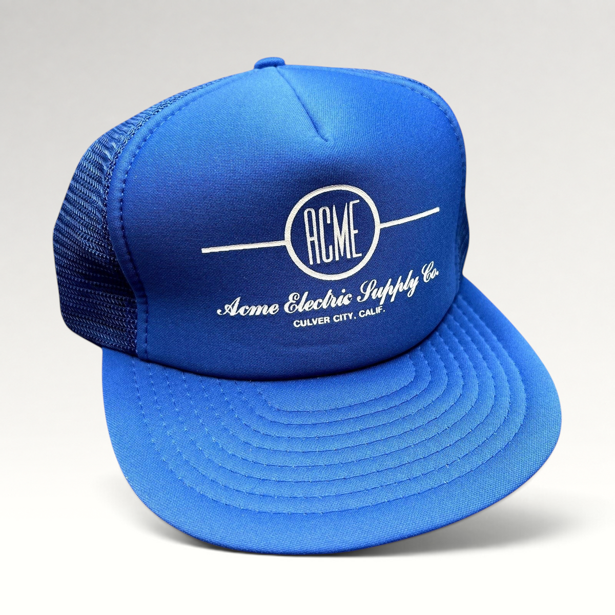 Raree Finds vintage royal blue foam and mesh trucker hat with white Acme Electric Supply Co. Culver City graphic