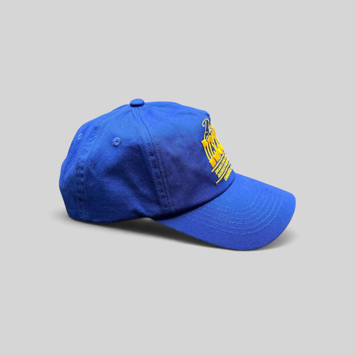 Raree Finds vintage royal blue snapback hat with yellow Dusty Disco embroidery and adjustable back closure