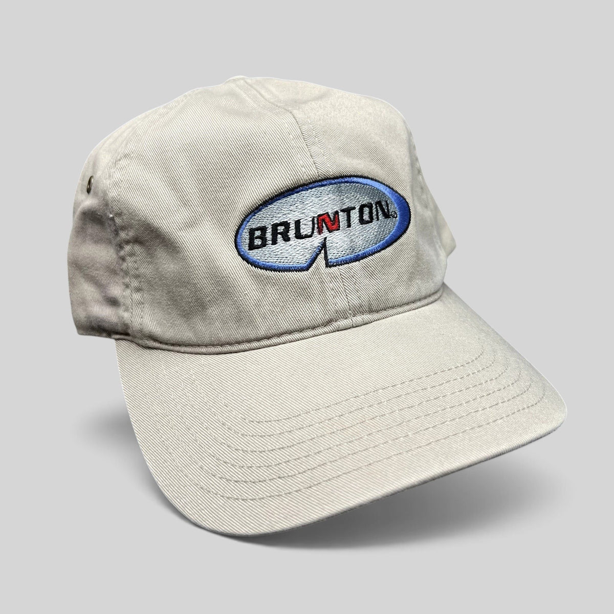 Raree Finds vintage khaki cotton Richardson strapback hat with embroidered Brunton logo and navy underbrim