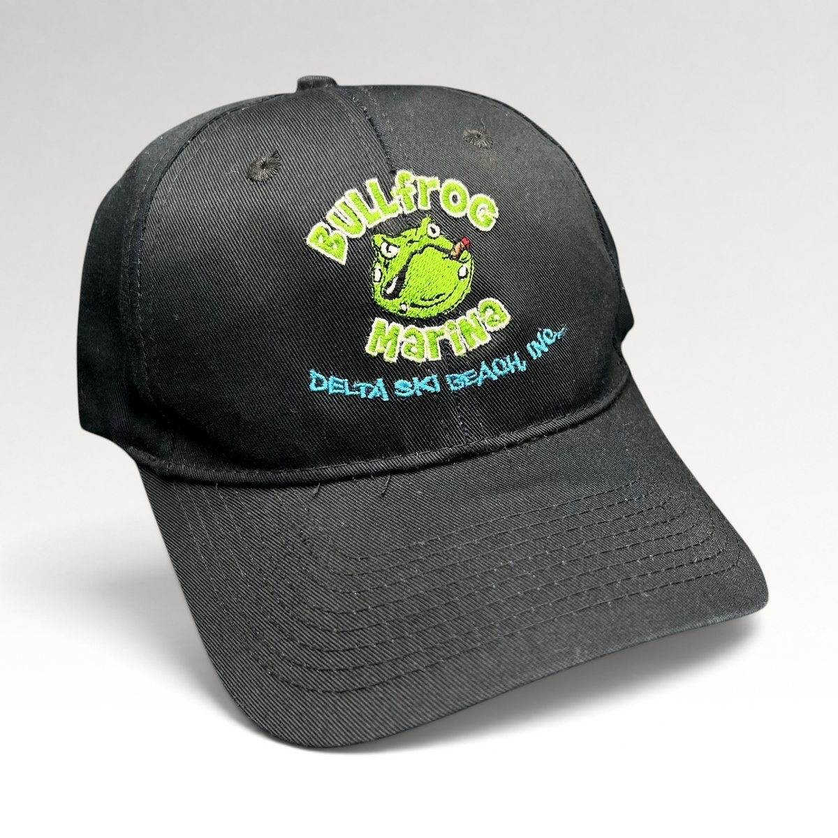 Raree Finds vintage black cotton strapback hat with embroidered Bullfrog Marina frog logo and aqua blue text