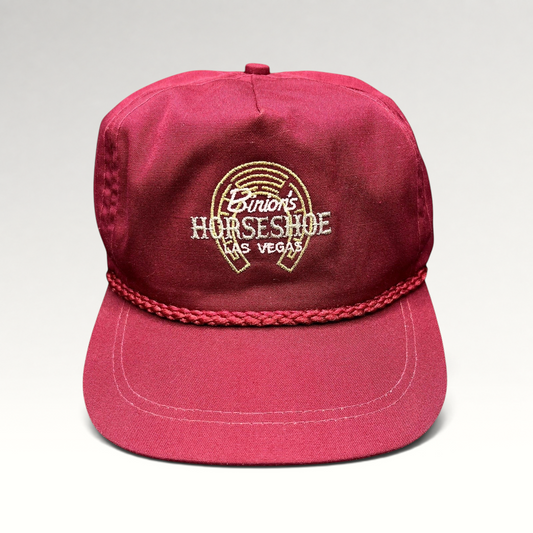 Raree Finds vintage burgundy cotton strapback hat with embroidered Binion’s Horseshoe Las Vegas logo and rope detail.