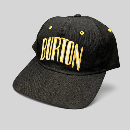 Raree Finds vintage Burton Snowboards snapback hat in black with gold embroidered lettering and structured design.