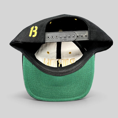 Raree Finds vintage Burton Snowboards snapback hat in black with green undervisor and embroidered 13 on the back