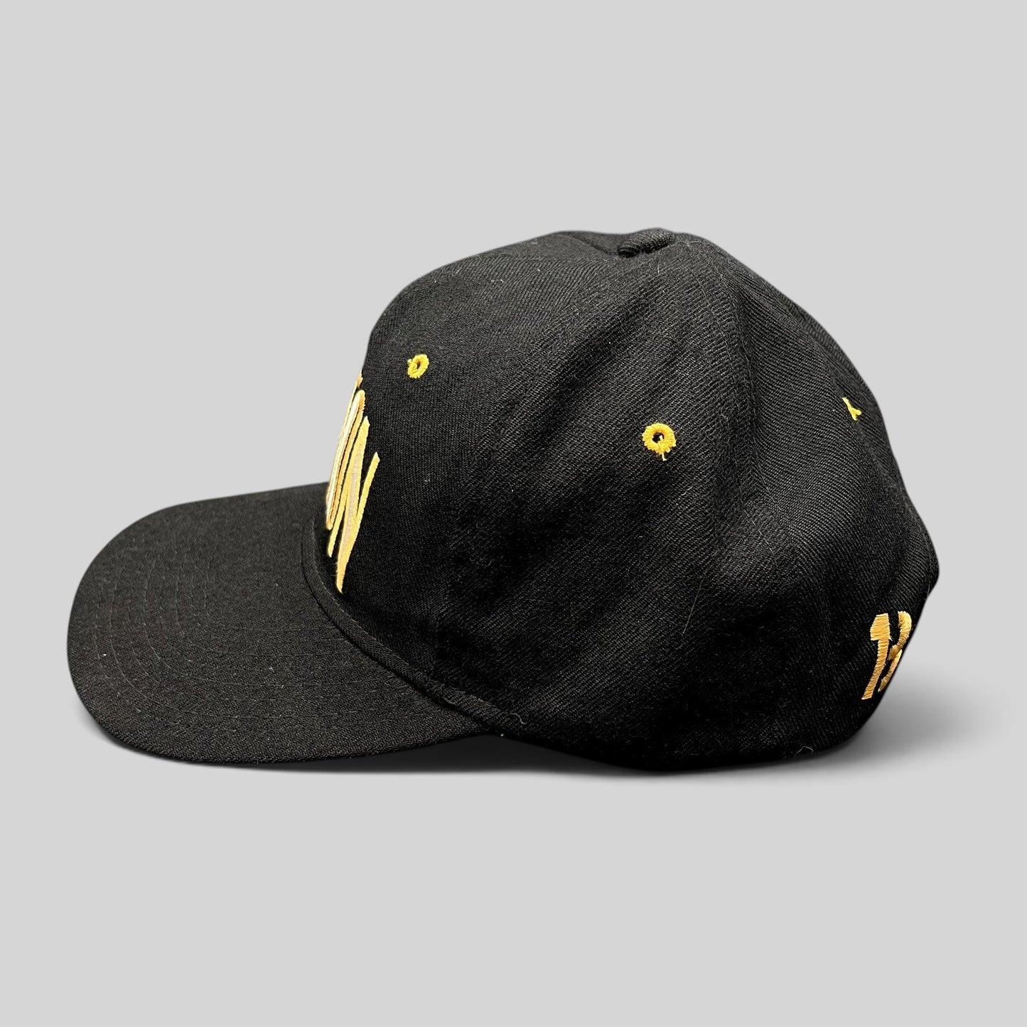 Raree Finds vintage black Burton Snowboards snapback hat with gold embroidery and green undervisor