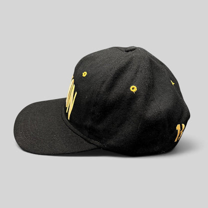 Raree Finds vintage black Burton Snowboards snapback hat with gold embroidery and green undervisor