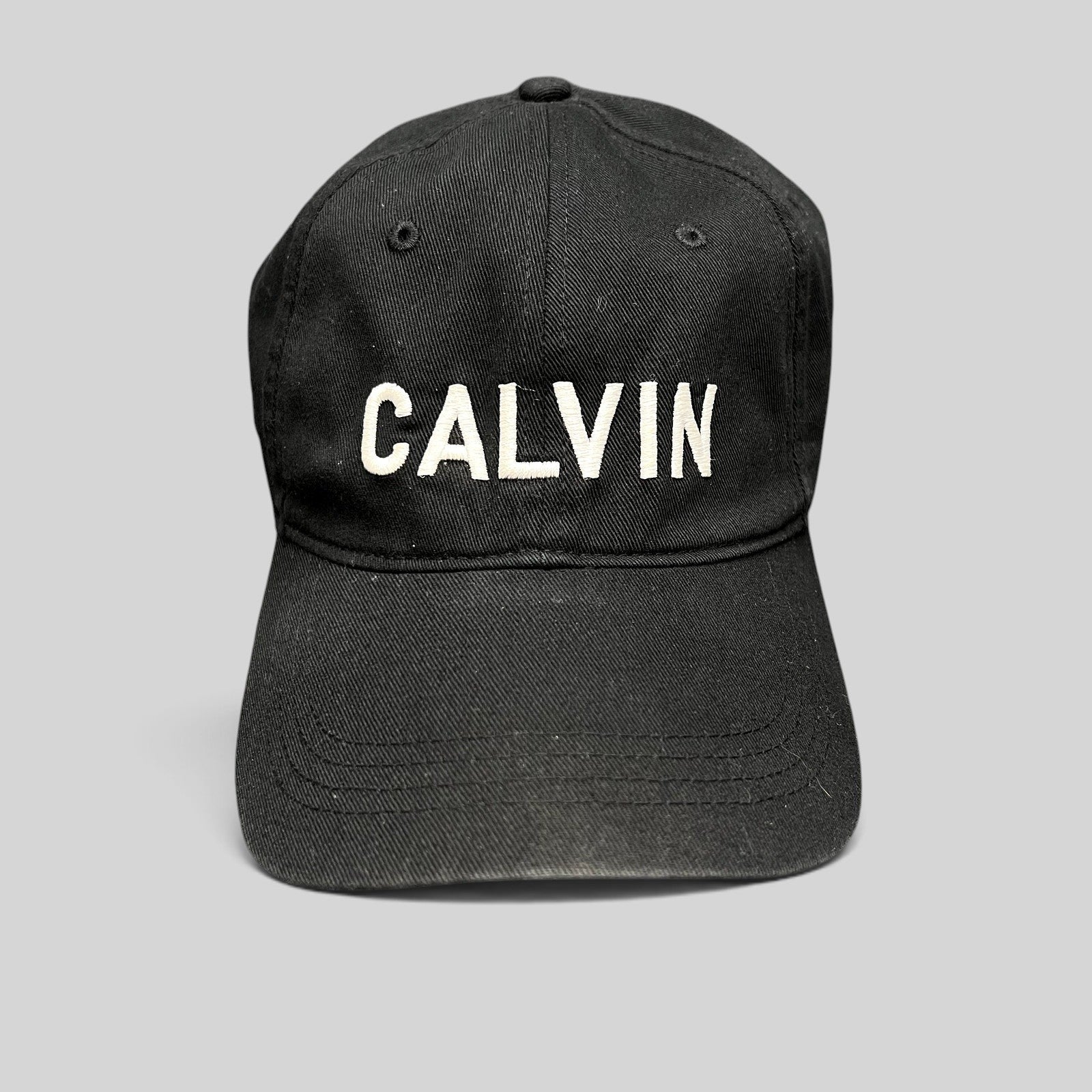 Raree Finds vintage black Calvin Klein strapback hat with white CALVIN embroidery on the front