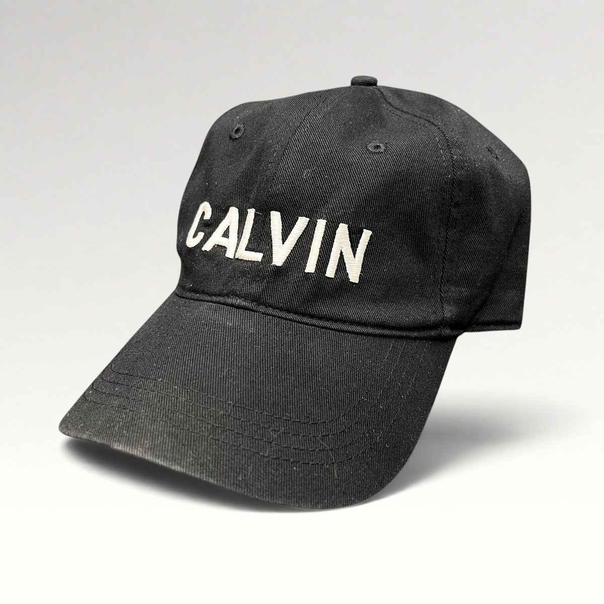 Raree Finds vintage black Calvin Klein cotton strapback hat with white CALVIN embroidery and curved brim