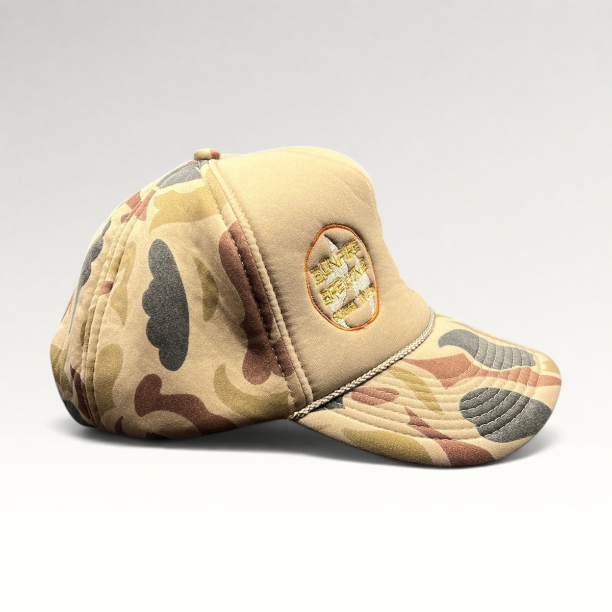 Raree Finds vintage Bonfire Brewing Co. tan camo snapback hat with rope detail and embroidered Aspen mountain logo.
