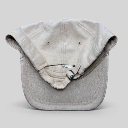 Raree Finds vintage off-white cotton canvas strapback hat with metal buckle closure, back view.