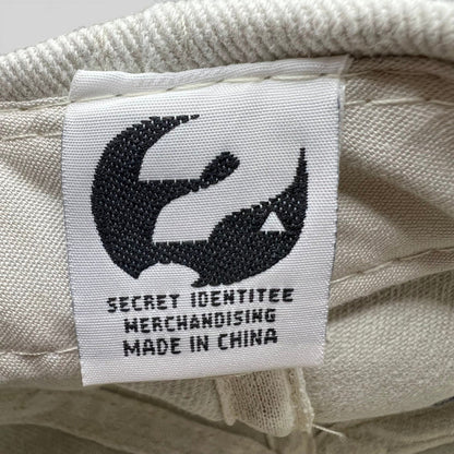 Raree Finds vintage cap interior tag featuring a black crow logo and Secret Identitee Merchandising text