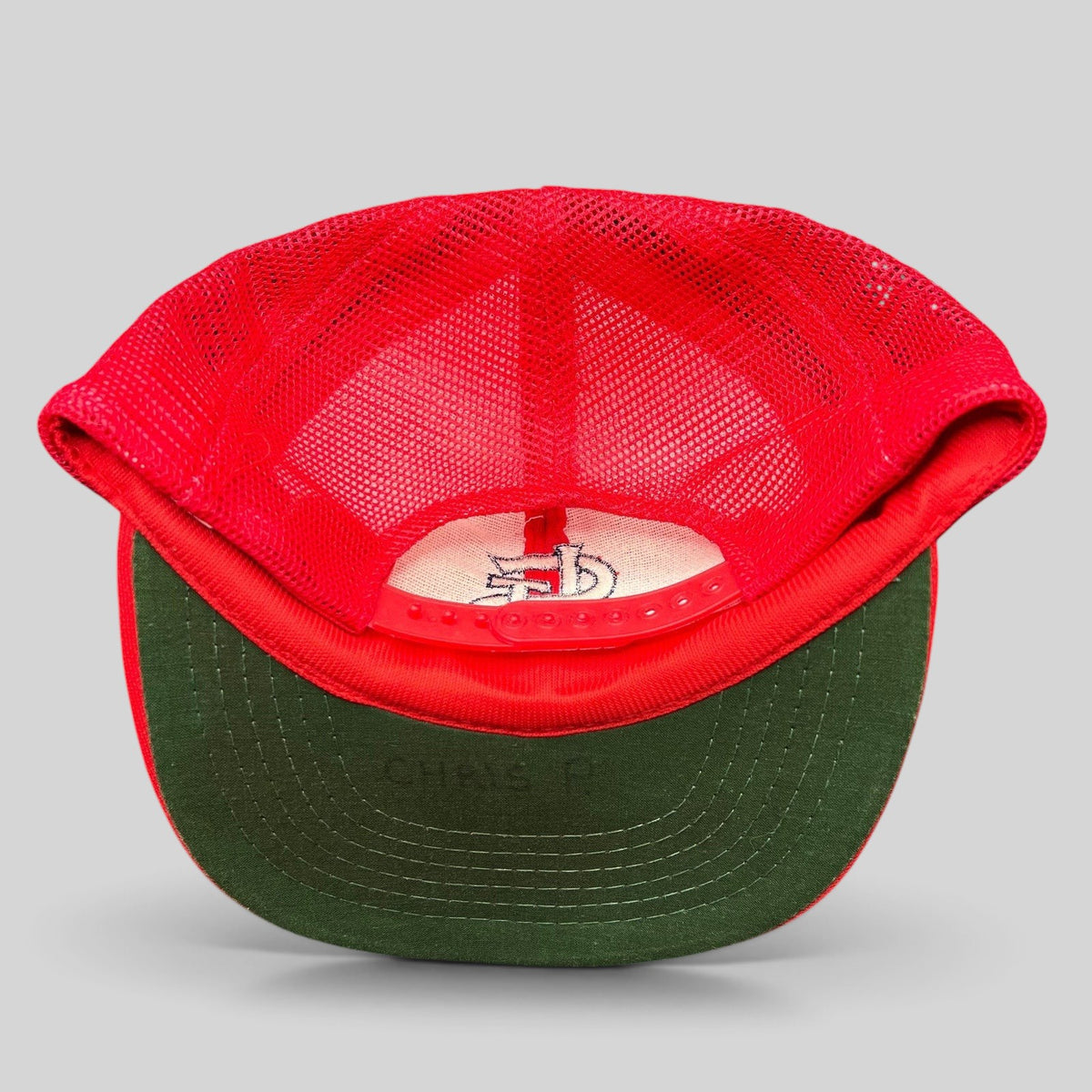 Raree Finds vintage St. Louis Cardinals mesh snapback hat showing the green undervisor and interior logo detail