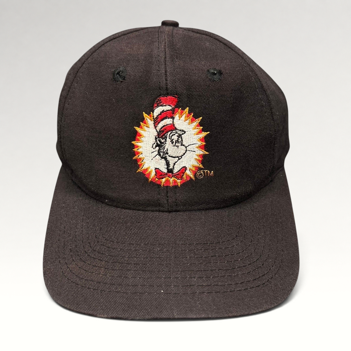 Raree Finds vintage 1994 black cotton snapback hat featuring an embroidered Cat in the Hat graphic on the front.
