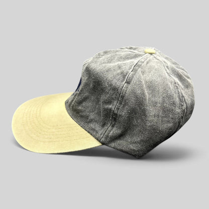 Raree Finds vintage Cobra Caps two-tone charcoal and khaki dad hat with a relaxed unstructured fit and brass buckle.