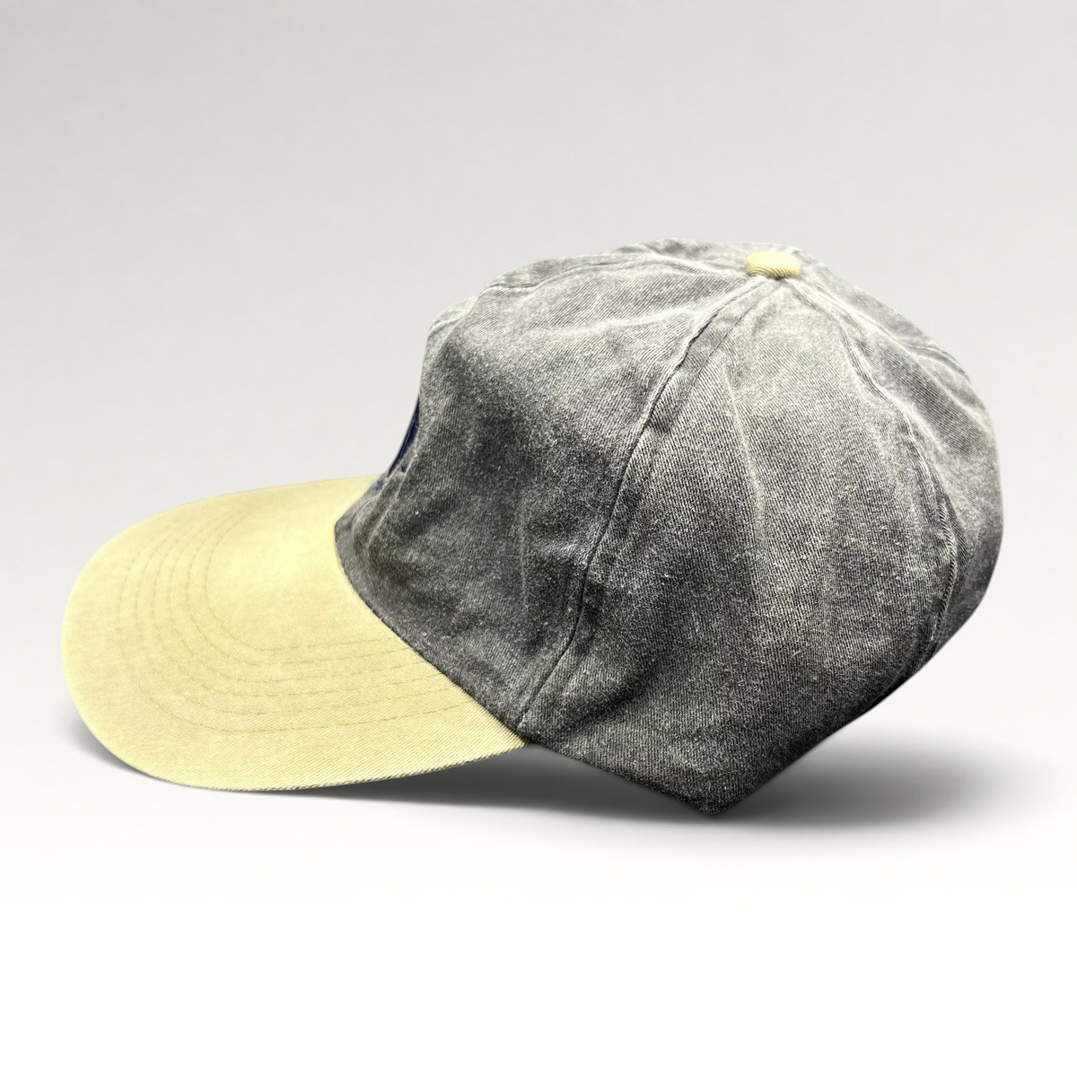 Raree Finds vintage Cobra Caps two-tone charcoal and khaki dad hat with a relaxed unstructured fit and brass buckle.