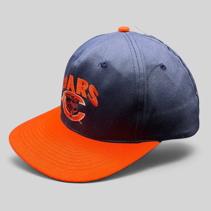 Raree Finds vintage 1990s Chicago Bears navy and orange snapback hat with embroidered team logo and orange brim.