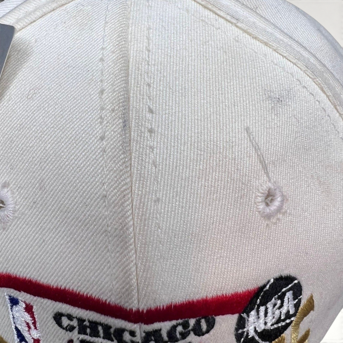 Raree Finds vintage 1996 Chicago Bulls NBA Champions snapback hat in cream cotton with embroidered team logo and text.