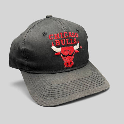 Raree Finds vintage 90s Chicago Bulls snapback hat in black with red embroidered team logo and green under-visor