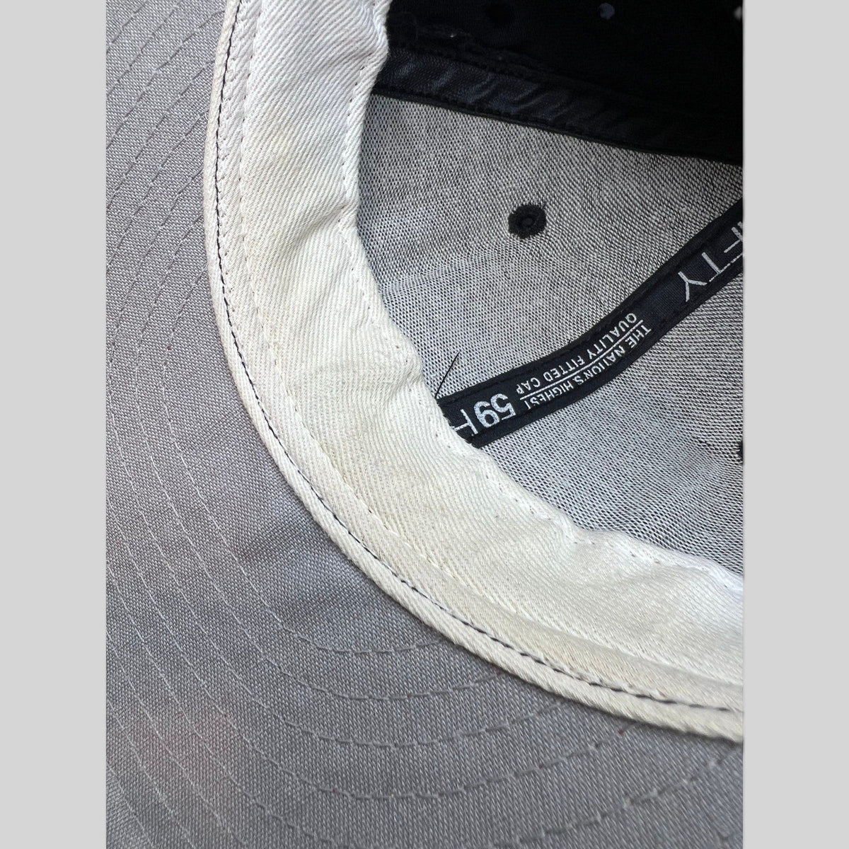 Raree Finds vintage New Era 59FIFTY Cleveland Indians cap interior showing white sweatband and gray undervisor