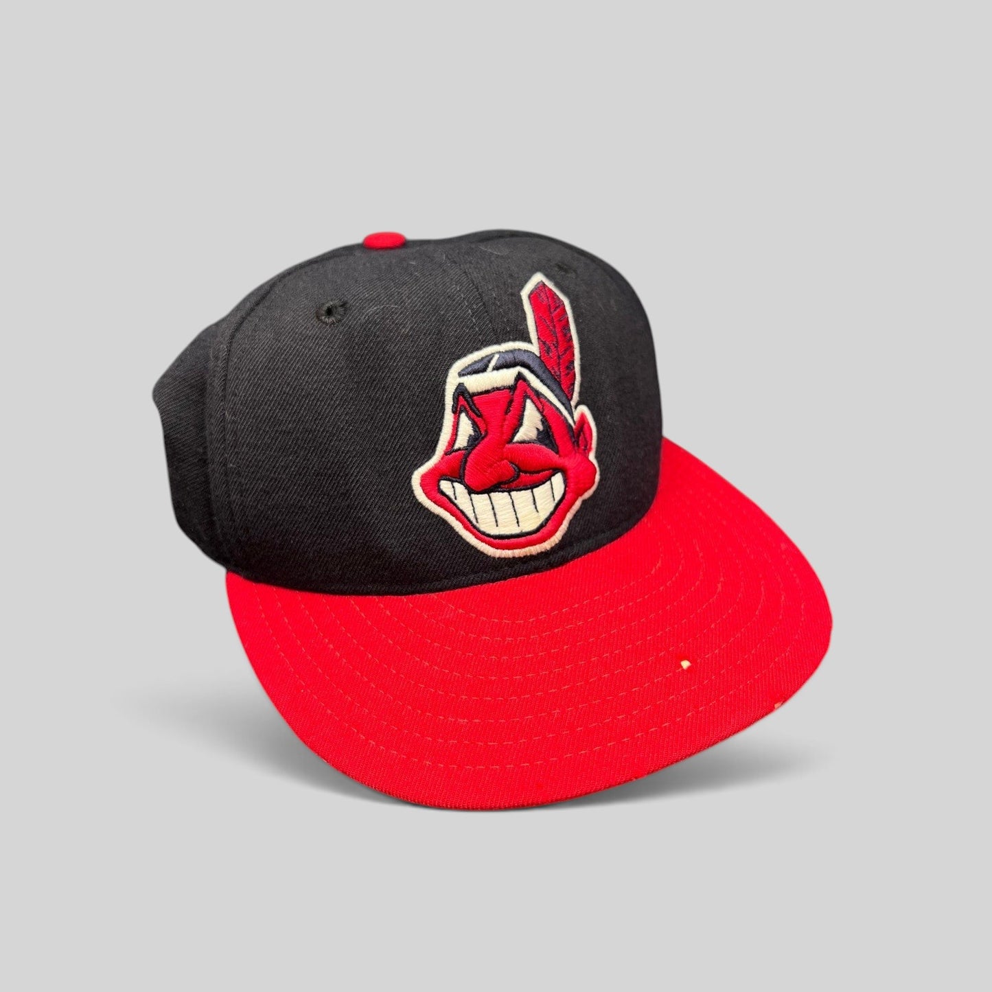 Raree Finds vintage New Era 59FIFTY Cleveland Indians wool fitted cap with red brim and Chief Wahoo logo