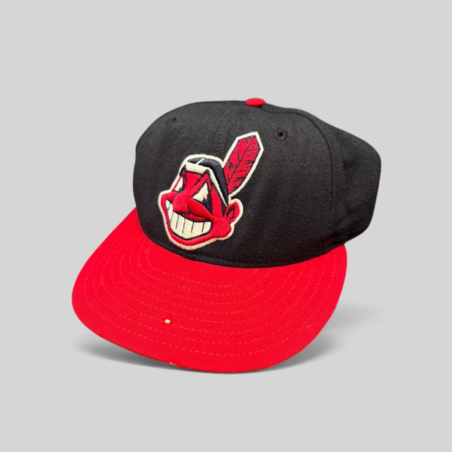 Raree Finds vintage New Era 59FIFTY Cleveland Indians wool cap with red brim and embroidered Chief Wahoo logo
