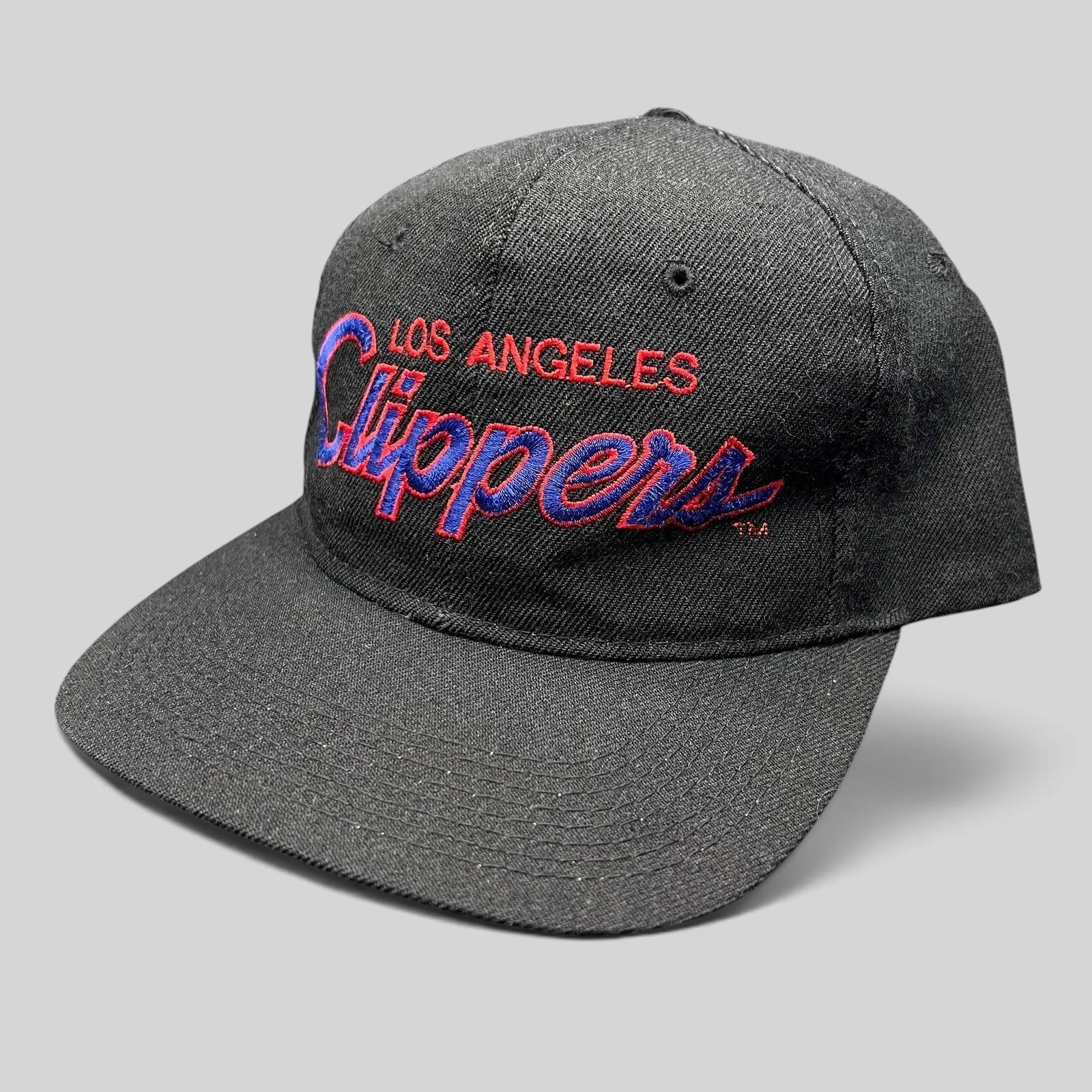 Raree Finds vintage Sports Specialties LA Clippers black snapback hat with red and blue embroidered script logo