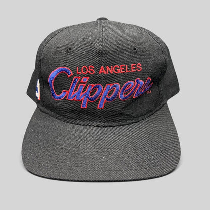 Raree Finds vintage Sports Specialties Los Angeles Clippers black snapback hat with red and blue script embroidery