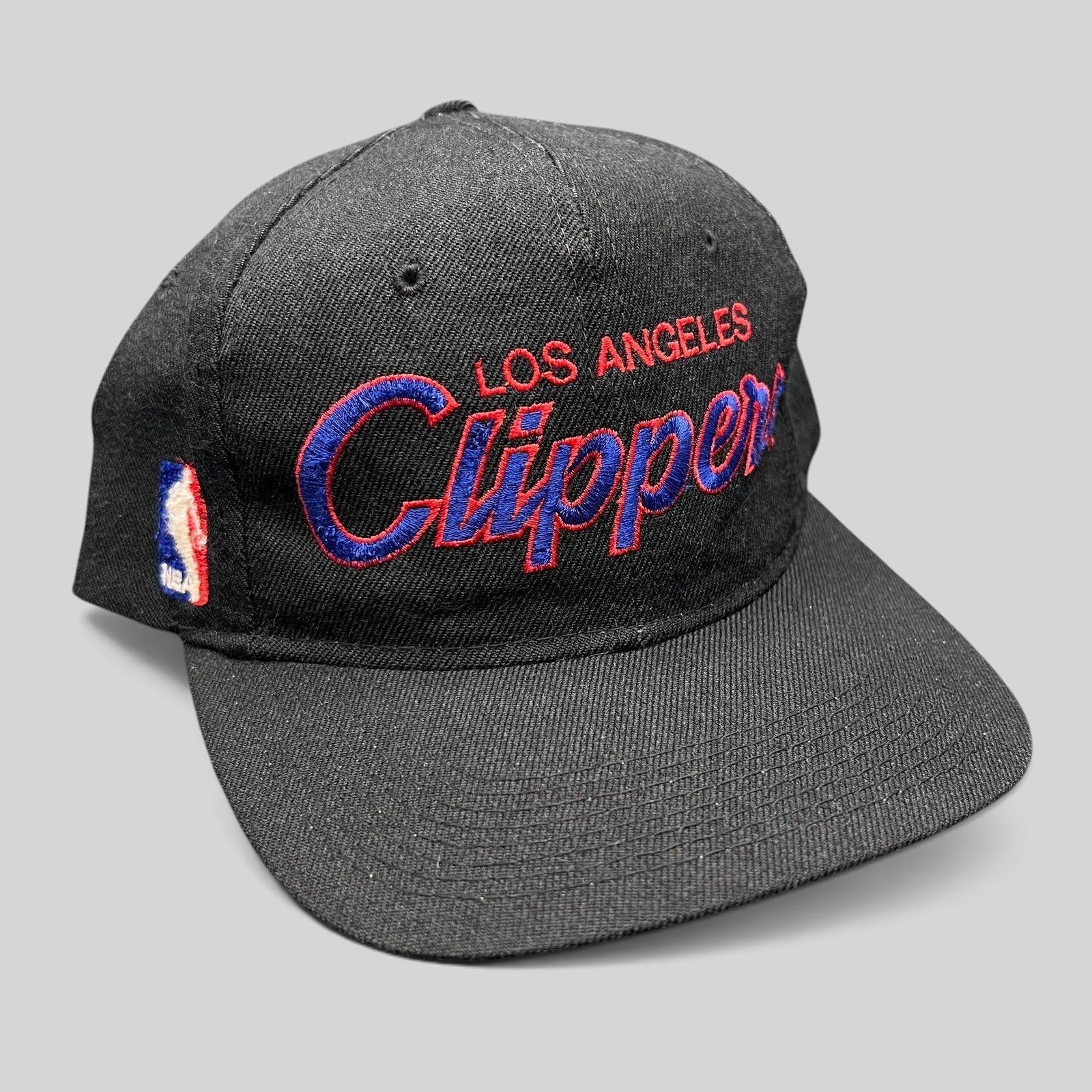 Raree Finds vintage Sports Specialties LA Clippers black snapback hat with red and blue embroidered script logo