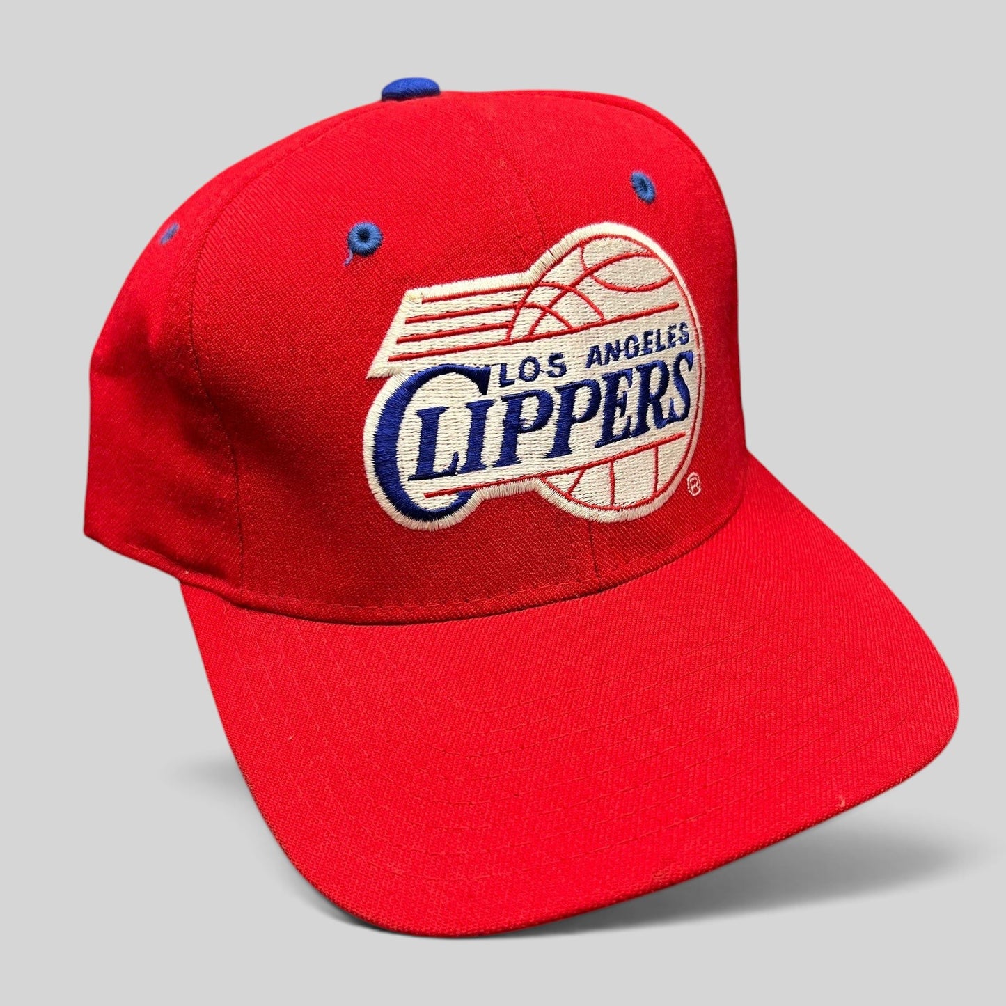Raree Finds vintage 90s Starter Los Angeles Clippers red fitted hat with classic script logo and green underbrim