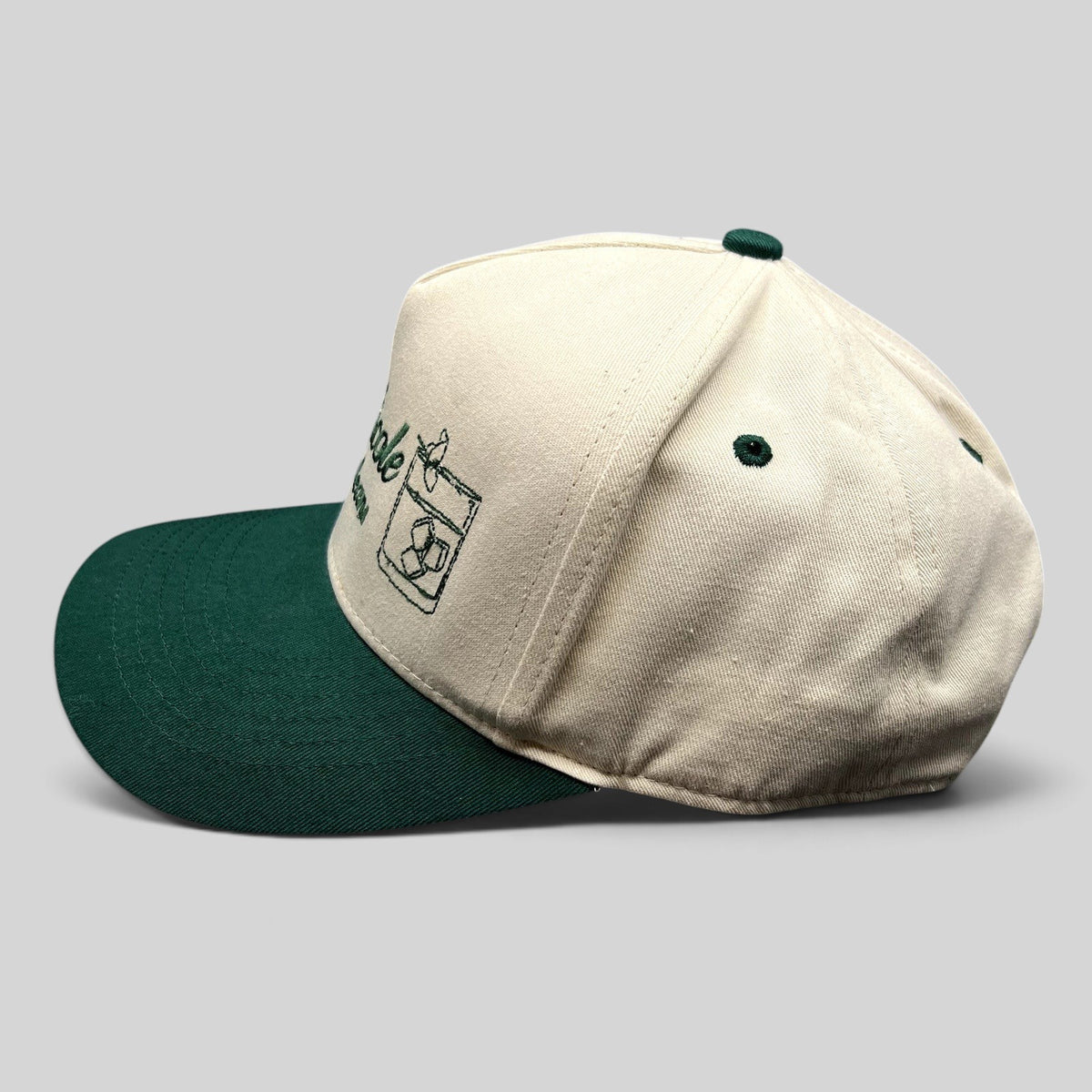 Raree Finds vintage Club Nicole New Orleans snapback hat in cream cotton with a green brim and cocktail embroidery.