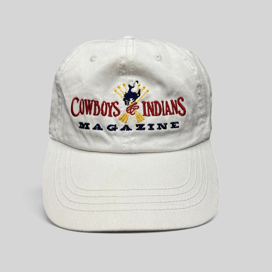 Raree Finds white cotton strapback hat featuring an embroidered Cowboys & Indians Magazine logo and bronc rider.
