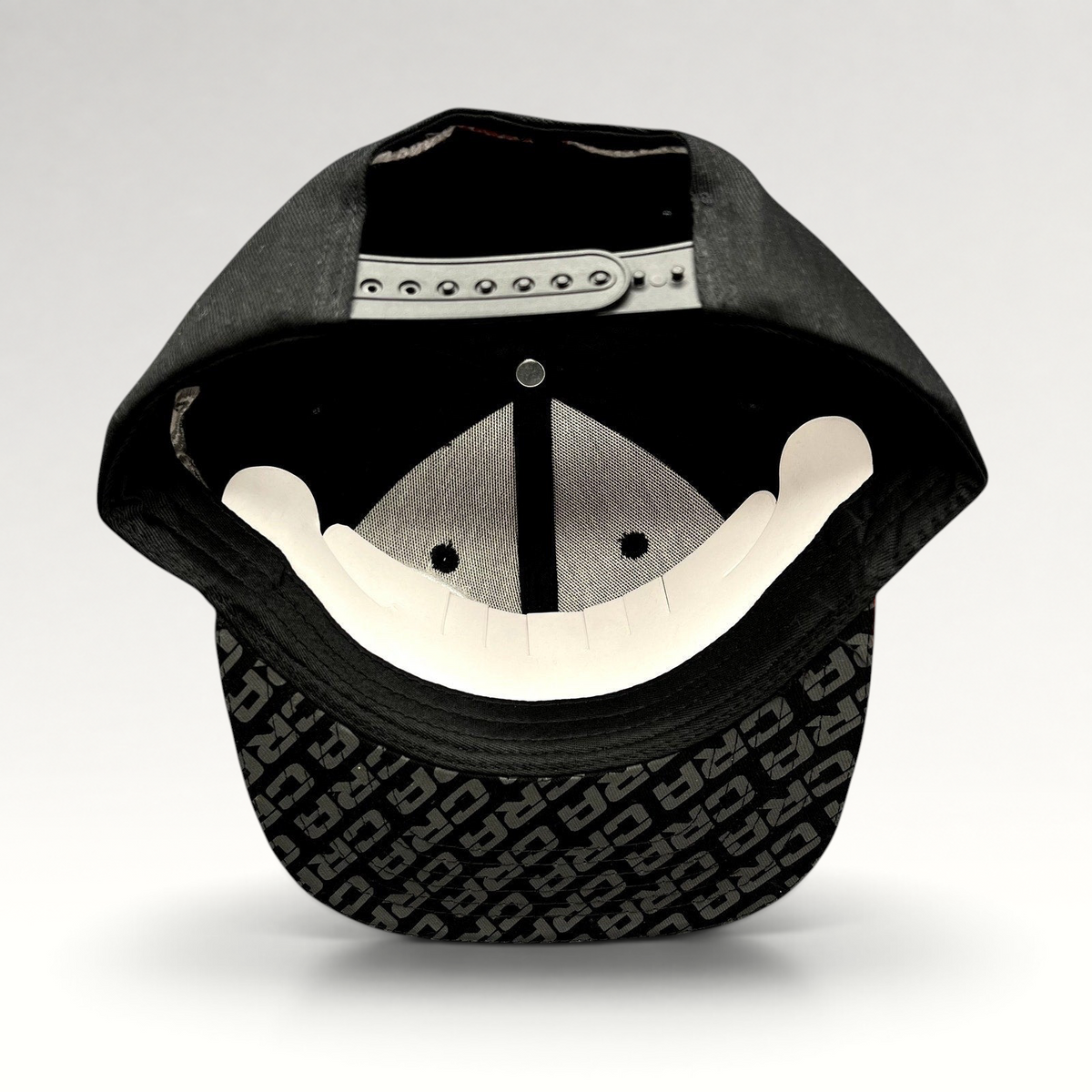 Raree Finds vintage CRA snapback hat showing the black adjustable strap and underbrim with all-over ERA logo print