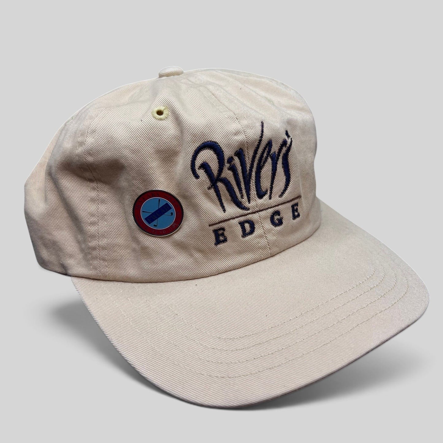 Raree Finds vintage cream Imperial golf strapback hat with Rivers Edge embroidered script and metal pin detail