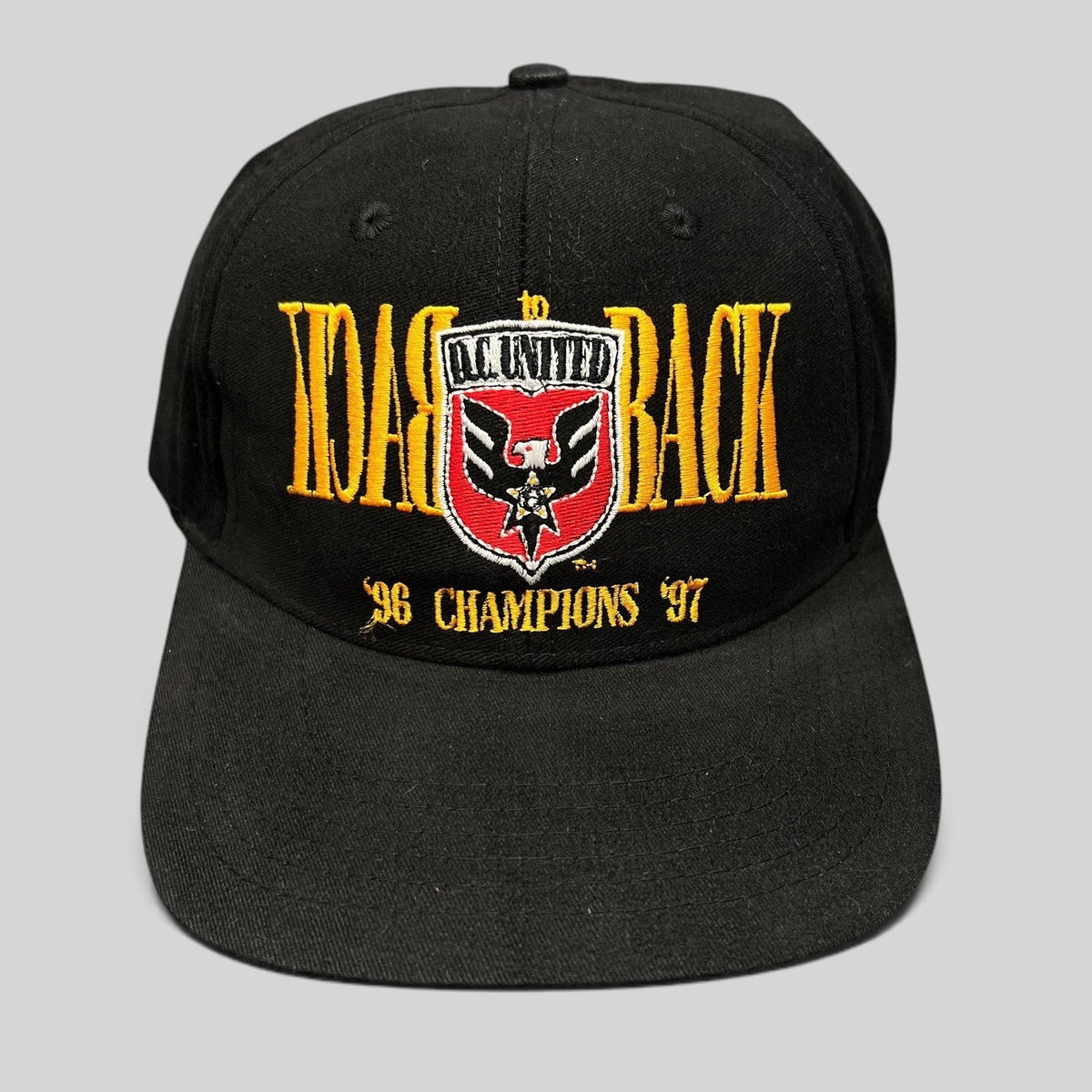 Raree Finds vintage black DC United snapback hat with embroidered 1996-1997 back-to-back MLS champions graphic