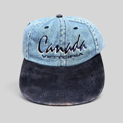 Raree Finds vintage 90s Canada Victoria snapback hat with light wash denim crown and navy suede-style brim