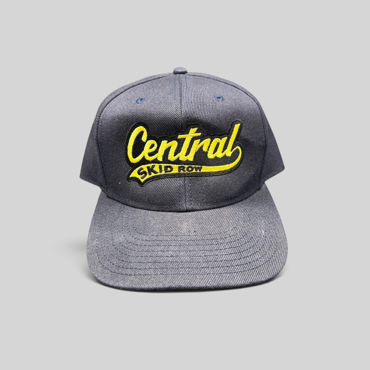 Raree Finds vintage 1990s navy blue denim OTTO cap with yellow Central Skid Row script embroidery