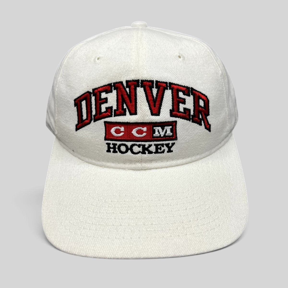 Raree Finds vintage white cotton Denver Hockey snapback hat with red and black embroidered CCM logo