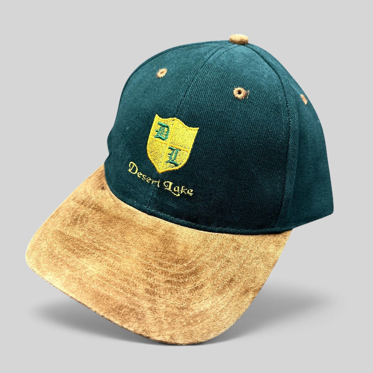 Raree Finds vintage Desert Lake golf strapback hat with a forest green cotton crown and tan suede-style brim.