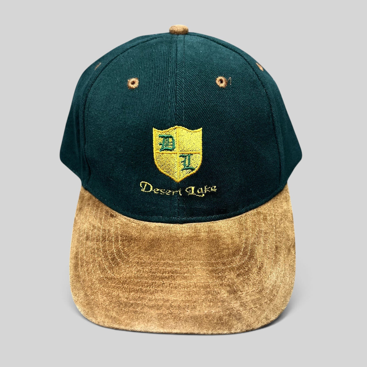 Raree Finds vintage Desert Lake golf strapback hat with a forest green cotton crown and tan suede-style brim.