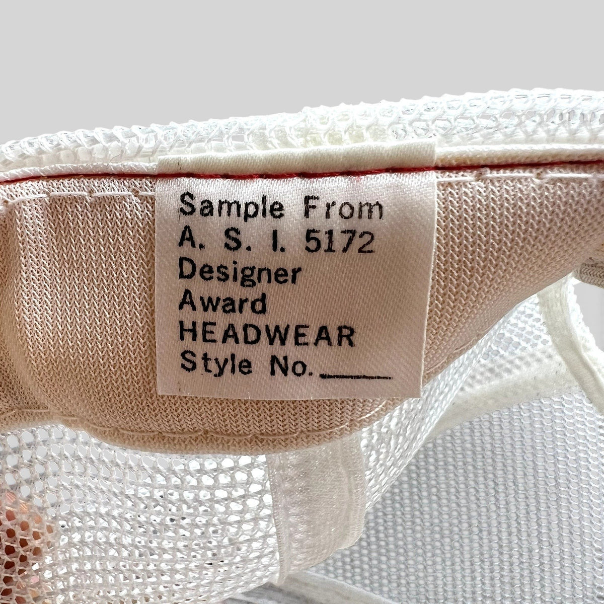 Raree Finds vintage 1980s Domino’s Pizza trucker hat interior sample tag from Designer Award Headwear