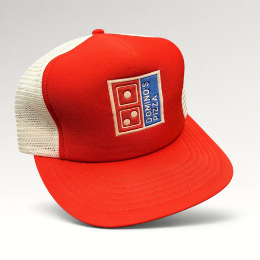 Raree Finds vintage 1980s Domino’s Pizza trucker hat with red foam front, white mesh back, and embroidered logo.