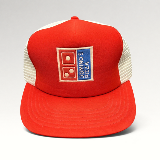 Raree Finds vintage 1980s Domino’s Pizza trucker hat with red foam front, white mesh back, and embroidered logo.
