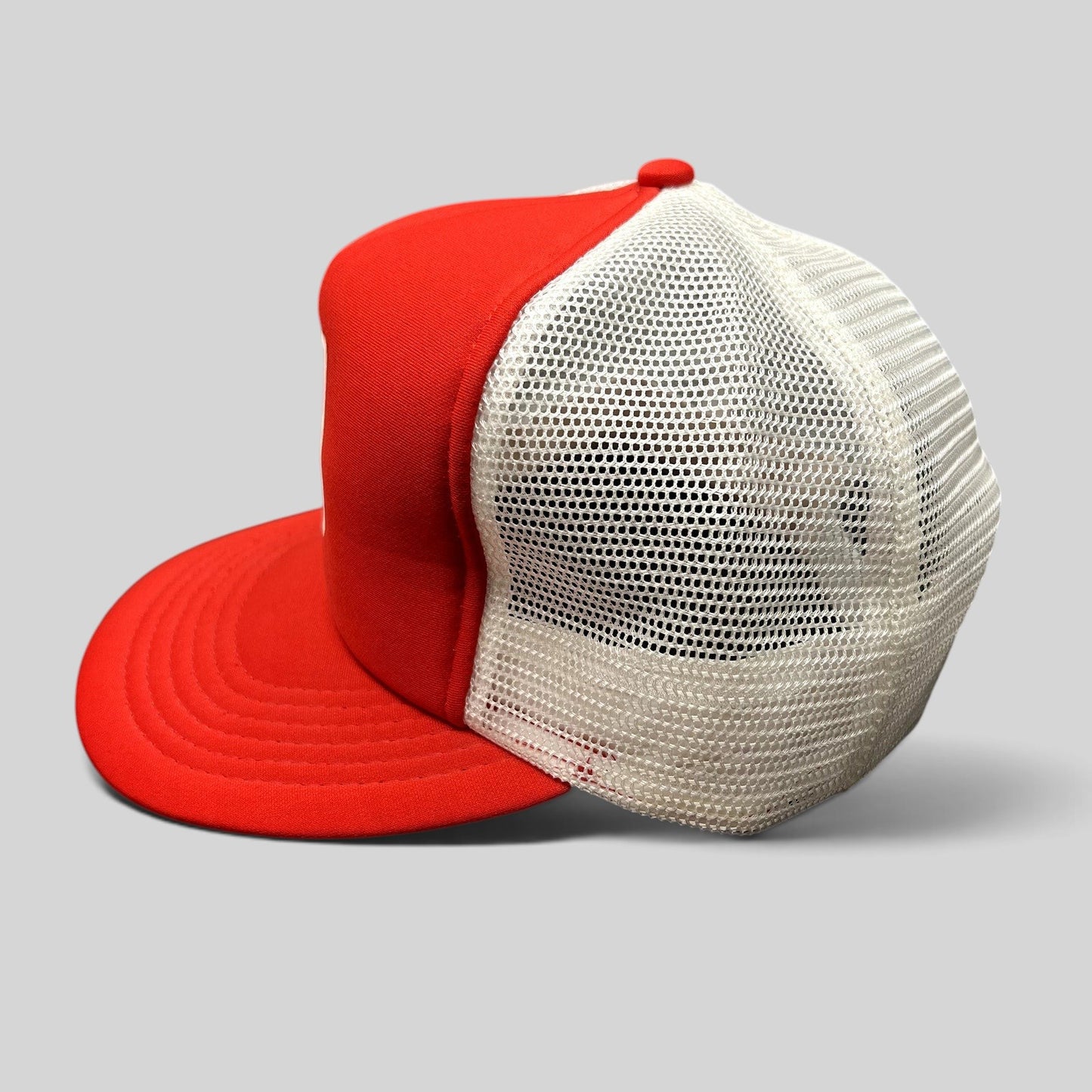 Raree Finds vintage 1980s Domino’s Pizza trucker hat with a red foam front, white mesh back, and snapback closure.