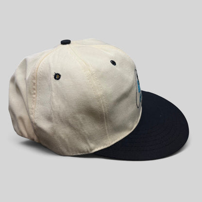 Raree Finds vintage Easton Pro 98 fitted golf hat with white crown, navy brim, and green undervisor