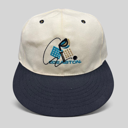 Raree Finds vintage Easton golf hat with white crown, navy brim, and embroidered club graphic on a Pro 98 fitted cap.